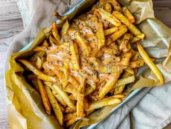Crispy golden fries topped with rich melted cheese, caramelized onions, and tangy special sauce for crave-worthy animal style flavor.